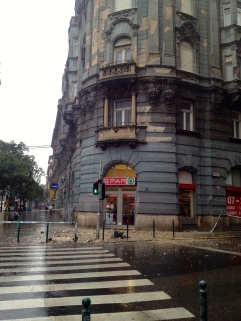 Heavy rain in Budapest destroys building.