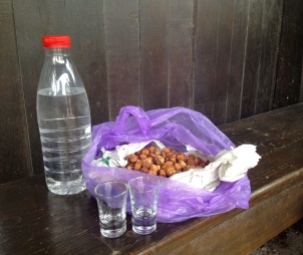 Serbian gifts of rakia and hazelnuts.